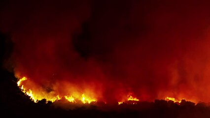 Wall Mural - Time lapse captures devastating power of wild fire raging through the night