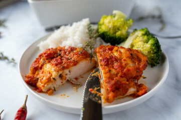 Wall Mural - Low fat meal with a delicious oven baked chicken breast with paprika sauce, basmati rice and broccoli