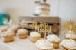 Baby Shower Cupcakes with a Gold Topper
