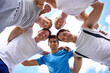 Men, circle and portrait with sports in low angle for hug, support or teamwork at training in nature. People, group and happy to embrace in huddle, scrum or together for exercise, workout or fitness