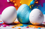 Fototapeta Miasta - White and blue Easter eggs with drops and splashes of paints.