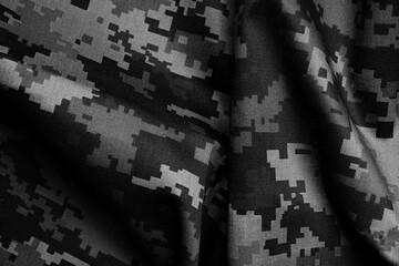 Texture of crumpled camouflage fabric as background, top view. Black and white effect