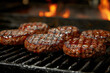 Grilled hamburger patties on a barbecue grill in a restaurant