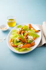 Wall Mural - Healthy salad with roasted pumpkin and almond