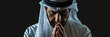 Arabian man prays to god on black studio background