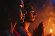 © wolfhound911 - Indian man and woman prays to god together on dark studio background. Cinematic effect
