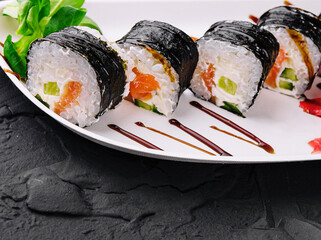 Wall Mural - nori sushi rolls with salmon on plate