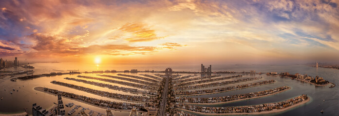 Wall Mural - beautiful, panoramic sunset view of the palm island in dubai, uae, from the marina to jumeirah and d