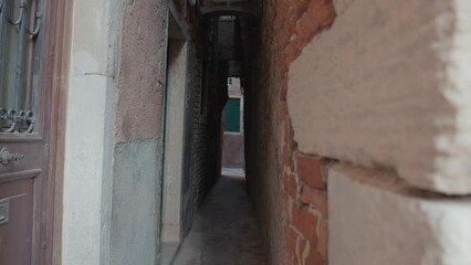 Wall Mural - Venetian Passage: Narrow Alley Mystery. Italy