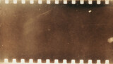 Dusty scratched and scanned old film texture with brown grain; grunge style