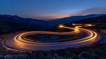 Wall Mural - Cars light trails at night in a curve asphalt, mountains road at night, long exposure image