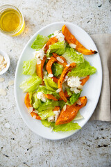 Wall Mural - Healthy salad with roasted pumpkin and almond