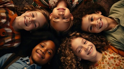 Wall Mural - Diverse group of adorable children lying in a circle on the floor, smiling and creating a joyful, captured from above