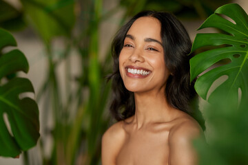 Wall Mural - beautiful natural woman with monstera leaves