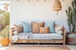 Pastel Blue Sofa in Bohemian Coastal Setting with Terracotta Pillows