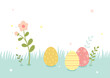 Easter eggs and flower branches on the grass background.