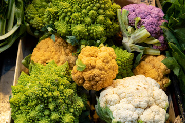 Wall Mural - colored cauliflowers and broccoli on sale at the market