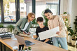 © LIGHTFIELD STUDIOS - young man with beard discussing startup project while showing charts to male colleagues near laptop