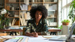 © ximich_natali - A young black woman office worker carefully organizes documents, makes the necessary notes at her workplace, demonstrating dedication to her business. Work in a modern office