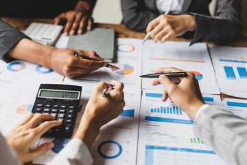 Business consulting meeting to discuss investment situation analysis and financial information for business strategy planning. Colleagues meeting to brainstorm statistical data analysis.