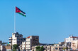 Large Jordanian flag flying over the city of Amman, Jordan
