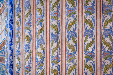 Wall Mural - Ornate blue and red hand painted wall decoration motif Turkish floral Islamic patterns in a traditional Ottoman style in Istanbul, Turkey	