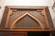 Doha, Qatar - February 8, 2024: A gate with wooden decorations inside Souq Waqif, Doha, Qatar