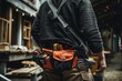 Close-up of maintenance worker carrying tool kit on waist for industrial repairs