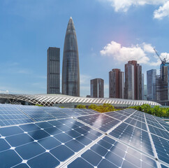 Wall Mural - solar panels with cityscape of modern city