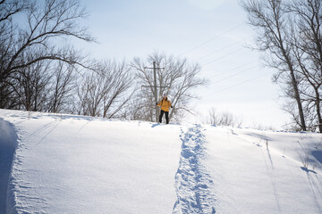 Sticker - Woman on skis standing on top of mountain wants to go down slope, skier assessing snow slope