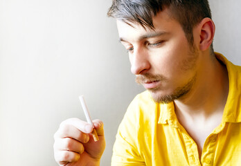 Canvas Print - Pensive Young Man with a Cigarette