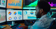 © GustavsMD - Quantitative Analyst Researching Statistical Market Models. Focused quantitative analyst researching and developing statistical market models on a multi-screen trading station.