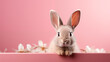 Cute Easter bunny on pink background with copy space