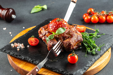 Wall Mural - Grilled ribeye beef steak with tomatoes, Healthy fats, clean eating for weight loss. top view. place for text