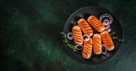 Wall Mural - Tasty grilled sausages. Long banner format. top view. copy space for text