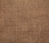 Fototapeta Kosmos - Close-up detail of fabric natural color Hemp material pattern design wallpaper. can be used as background or for graphic design. Natural linen material textile canvas Fabric texture background
