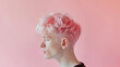 Profile of young men with pink hair on pastel background.