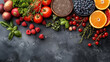 Assortment of a variety of healthy fresh food on a dark background, copyspace