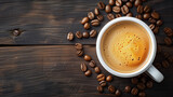 Fototapeta Nowy Jork - Top view of a cup of coffee with coffee beans on a wooden table