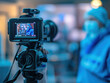 © aka_artiom - A camcorder records the COVID-19 impact. Media prioritize safety, face financial crisis, event cancellations, and stress the importance of health