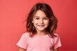 © Inigo - Portrait of a cute smiling little girl on a pink background.