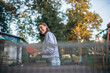 © velimir - young woman playing ping pong in an amusement park