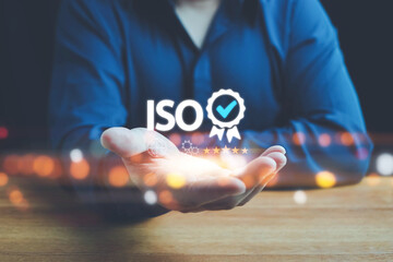 ISO standards quality control, assurance and warranty business technology concept. Touching on screen with ISO and globe icons on smart background. ISO Standard certification. Modern ISO banner.