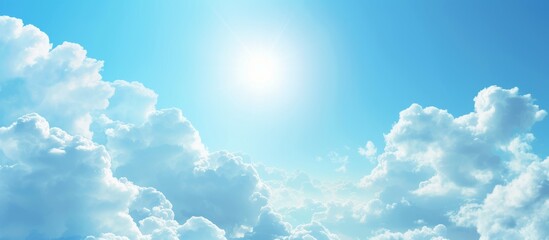 Wall Mural - Serene Blue Sky with Fluffy White Clouds and Radiant Sun Above