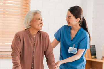 Health insurance service, Young Asian caregiver nurse examine senior man or woman patient at home. Attractive specialist career female support give advise and therapy consult to older elderly mature