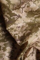 Poster - Texture of crumpled camouflage fabric as background, top view