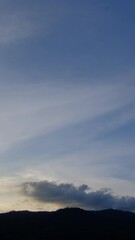 Wall Mural - breathtaking scene of the sun setting over the majestic mountains time lapse video, painting the sky
