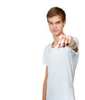 © CastingOnWhite/peopleimages.com - Man, portrait and hand pointing at you with mockup in studio for choice, accountability or decision on white background. Face, vote or gen z model with finger gesture, invitation or volunteering call