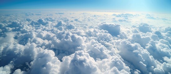 Wall Mural - serene aerial view of clouds from an airplane window, travel and freedom concept
