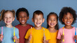 © Jammer Gene - Diverse group of kids in bright shirts holding up toothbrushes and smiling. Concept for good oral health at young age.